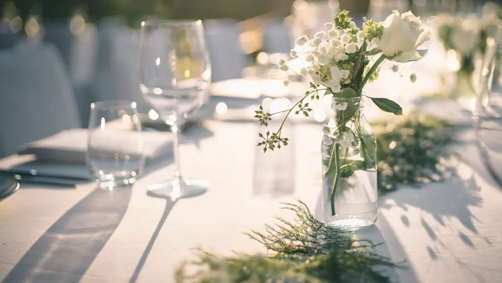 table with glasses and flowers